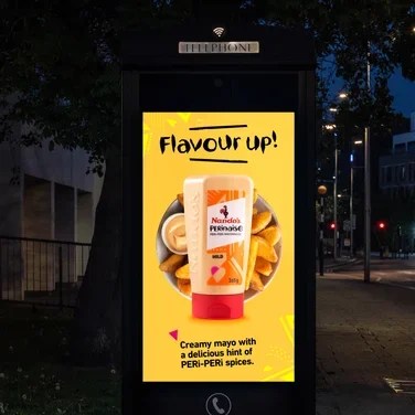 A digital billboard featuring Nando's PERInaise and the tagline 'Flavour Up!'